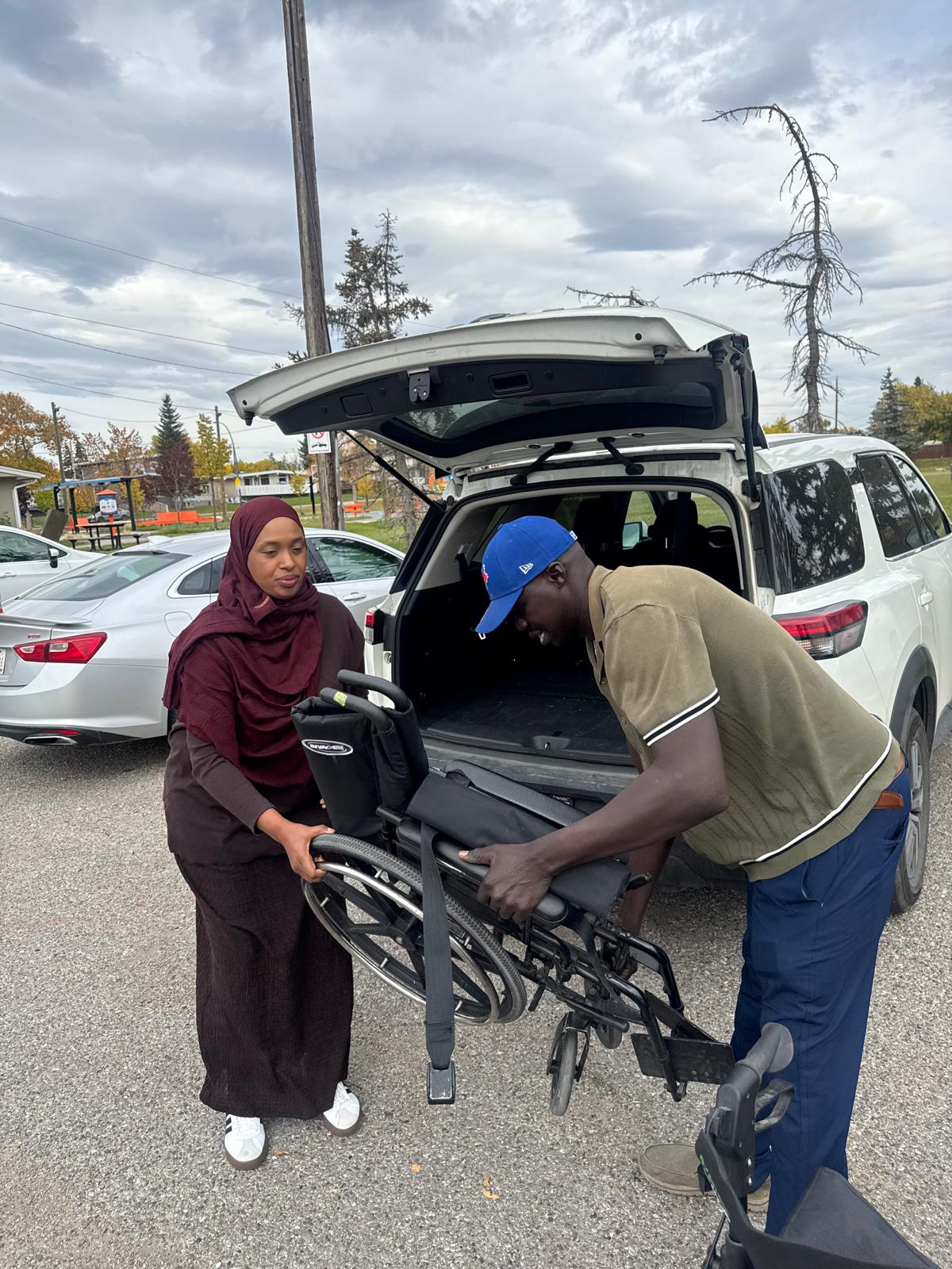A wheelchair being unloaded during EquiPath Foundation’s donation to YES Youthcentre